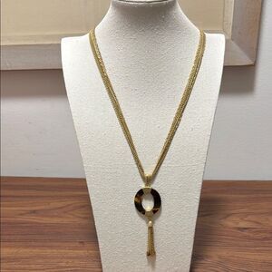 Coldwater Creek Signed 7 Strand GoldTone Necklace with Amber Colored Pendant.
